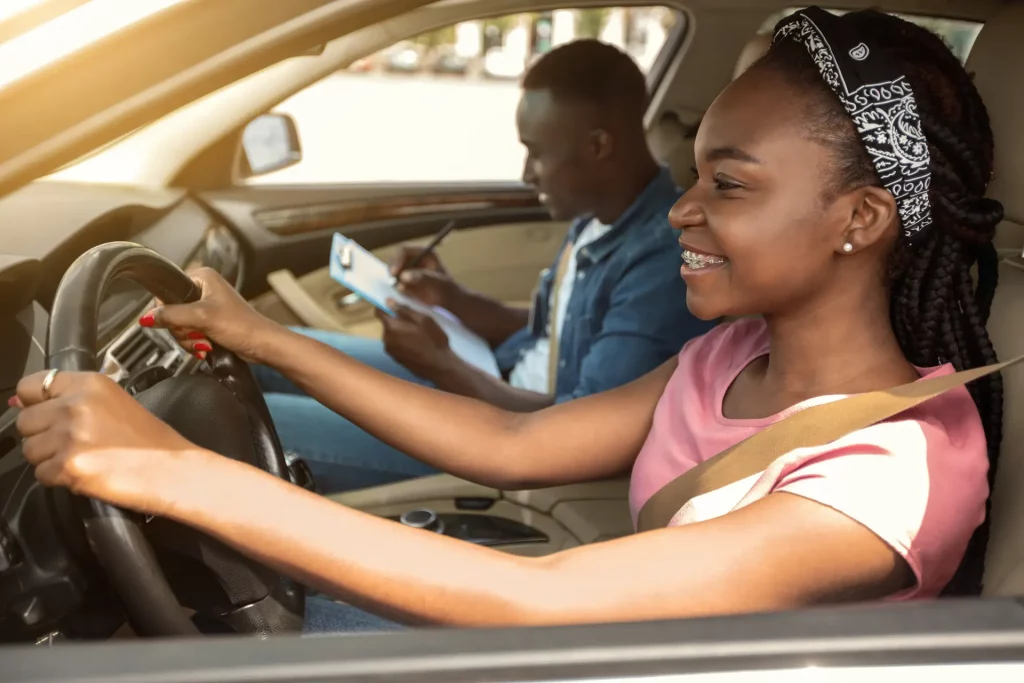 Learner driver practicing with instructor in car, showing real lesson setting for can learners drive on the motorway.